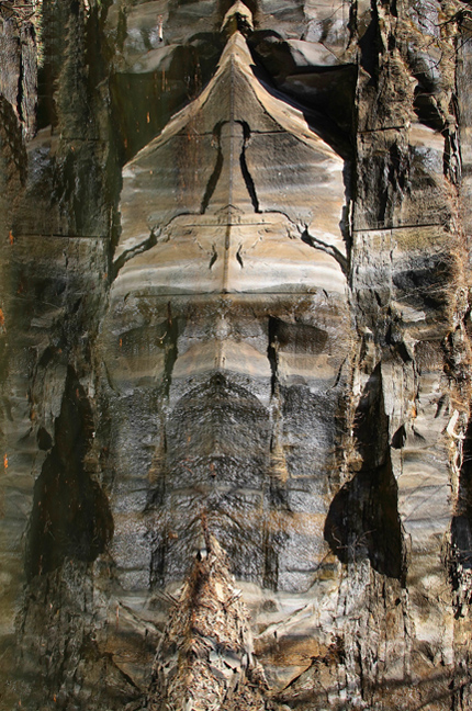 Reflection Of A Rock Face