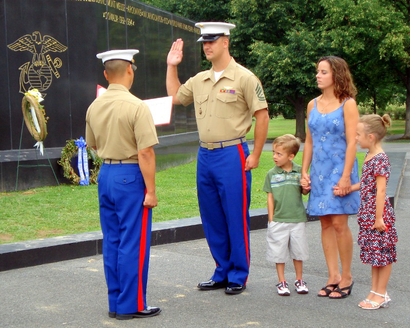 young father re-upping at the Marine Memorial (Washington DC)