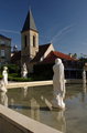 St John Baptist 12th century simple tower - little French town great history