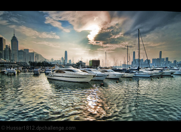 Sun sets over fragrant harbor.