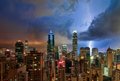 Charged Skyscape over Glowing Cityscape
