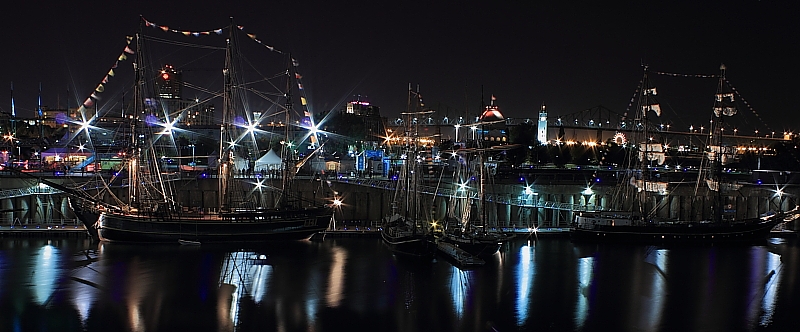 sailing ships under spotlights