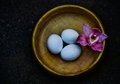 An Orchid and Three Eggs