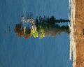 Third dimension:  horizontal reflection of vertical photographer