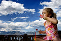 On the deck, bubbles in one hand, a lollipop in the other, what could be better?