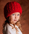 Toddler with the Red Hat and Blue Eyes.