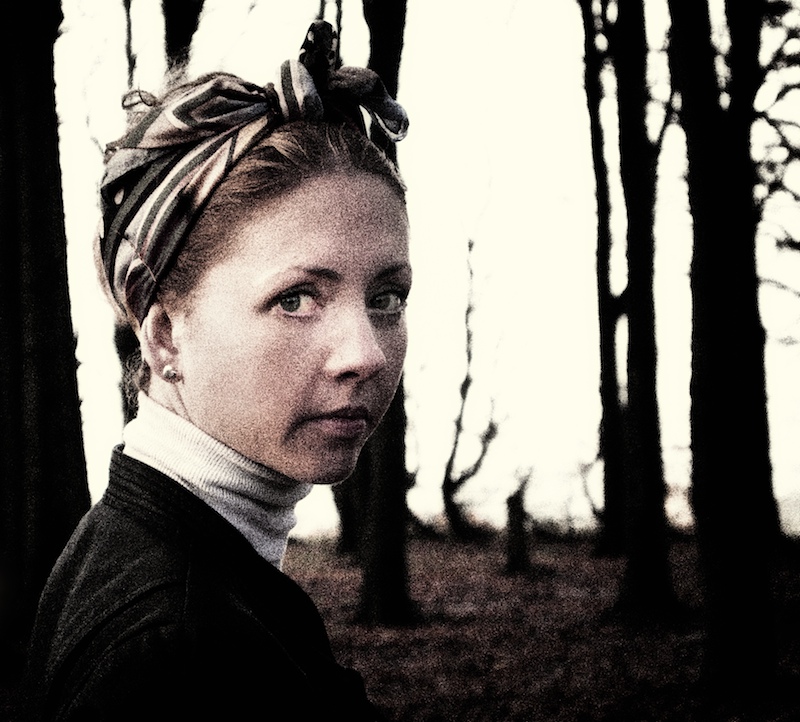 As she walks amongst the trees