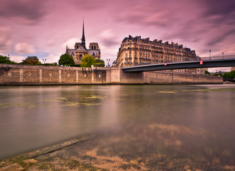 The River was flowing quietly like the Time on the old stones of Notre-Dame