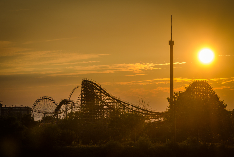 Golden hour over roller coaster