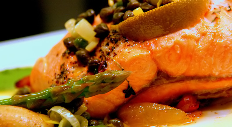 Baked salmon with aspargus,capers,redcurrant, leek and pickeld pear