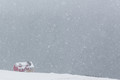 Red house in snow storm