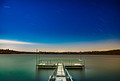 Moonlit pier & star trails