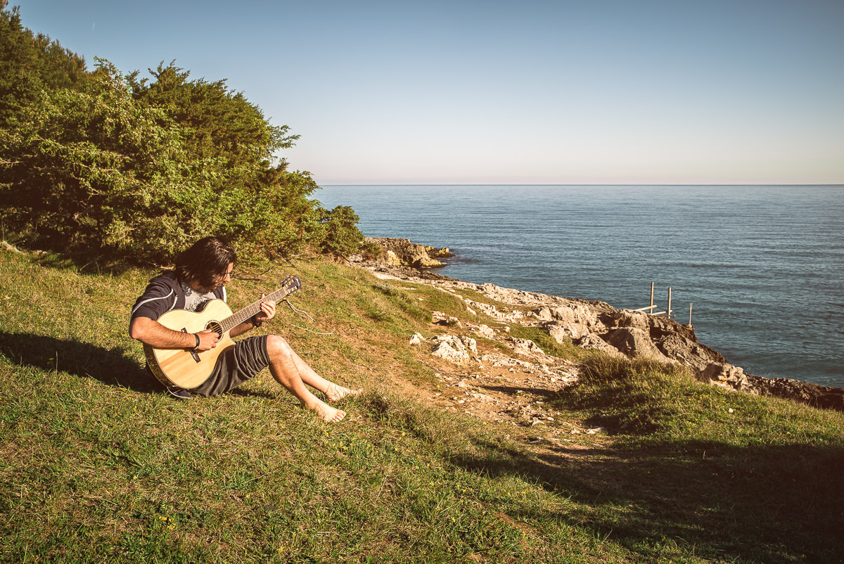 Playing my Guitar by the Ocean, at Sunrise