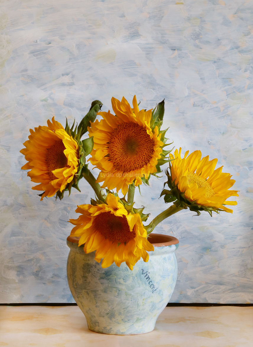 Four Sunflowers In a Vase