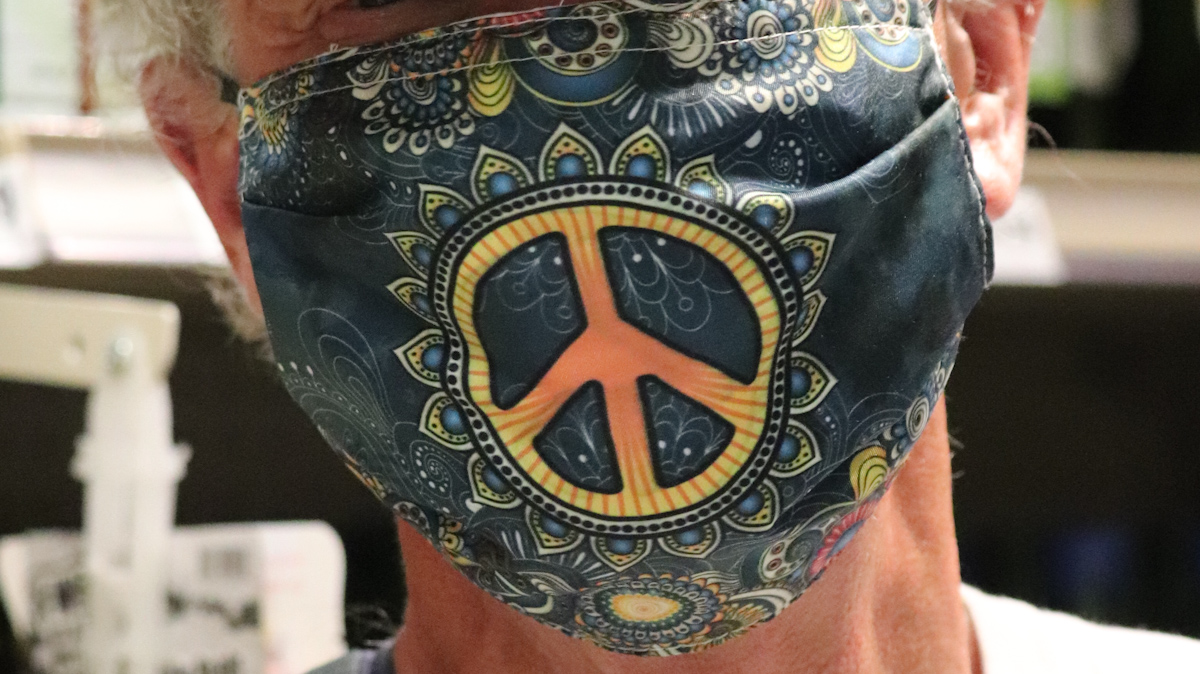 Peace sign smile.