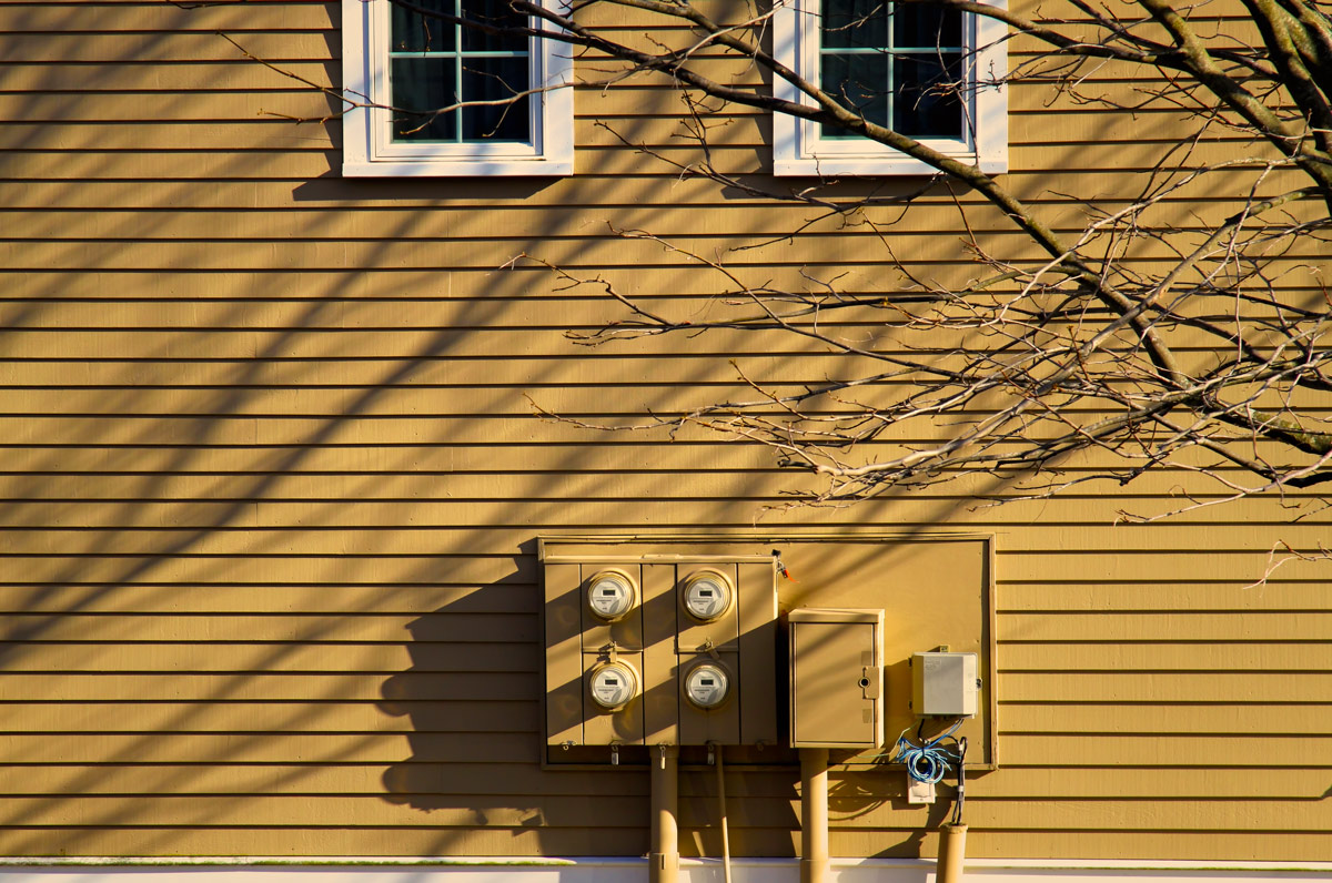 Clapboards, branches and shadows