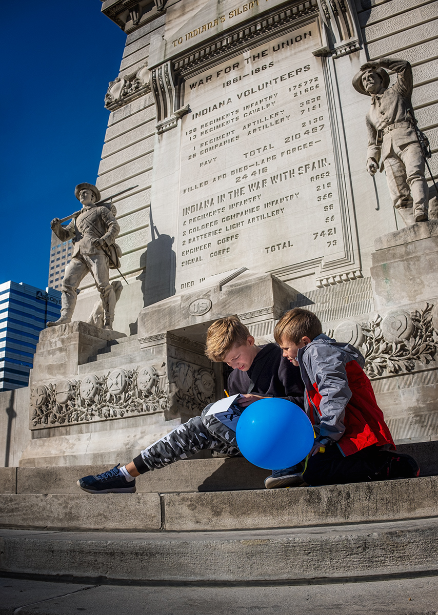 Boys on steps of the monument