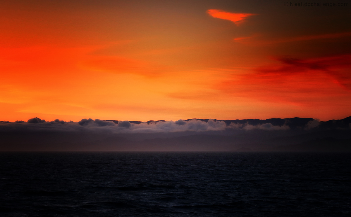 Alaskan summer time late sunset on a boat cruise 