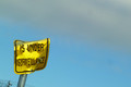 Do you think the one who damaged the sign got caught?