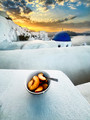 Enjoying the sunrise with a bowl of fresh peaches