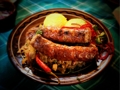 pork sausage and sour cabbage served with polenta and pickled hot pepper 