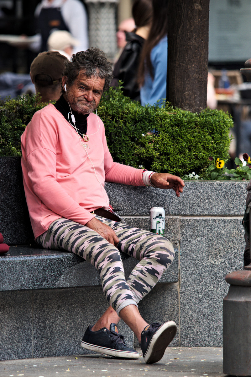 A man relaxing in a public square in Cordoba