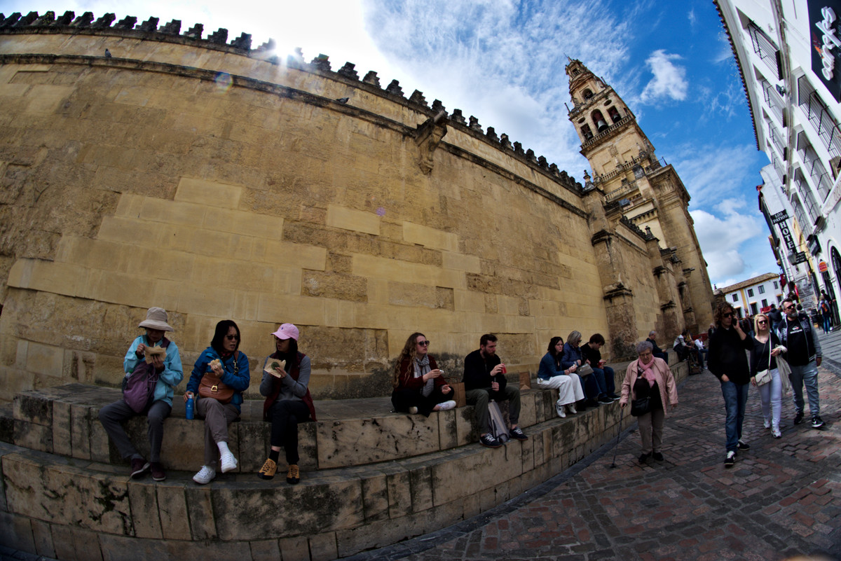 People relaxing ny the typical Mosque  of Cordoba