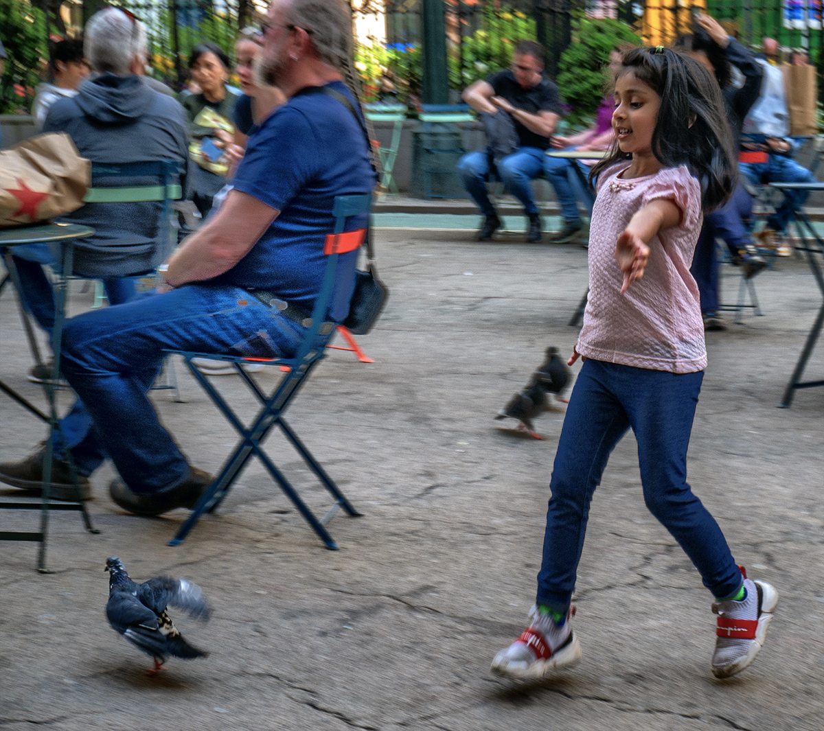 floating girl chasing pigeons