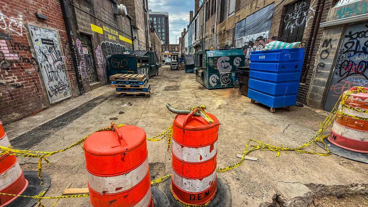 Across the Downed Tape, the Garbage Awaits