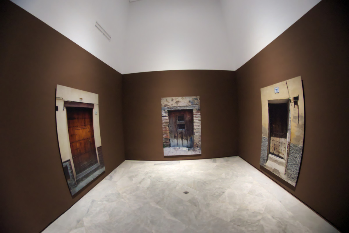 Empty exhibition rooms with works of arts on the walls