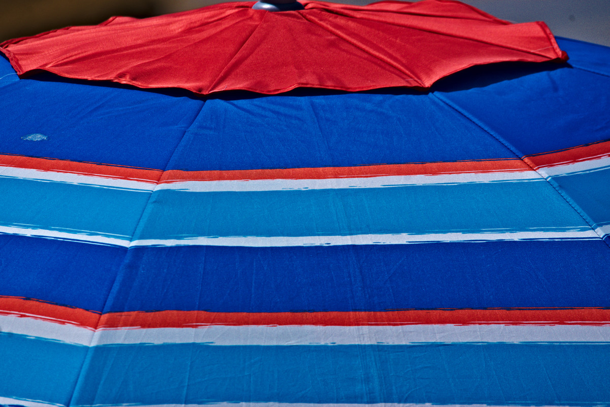 Detail of a shade on the beach in Cadiz