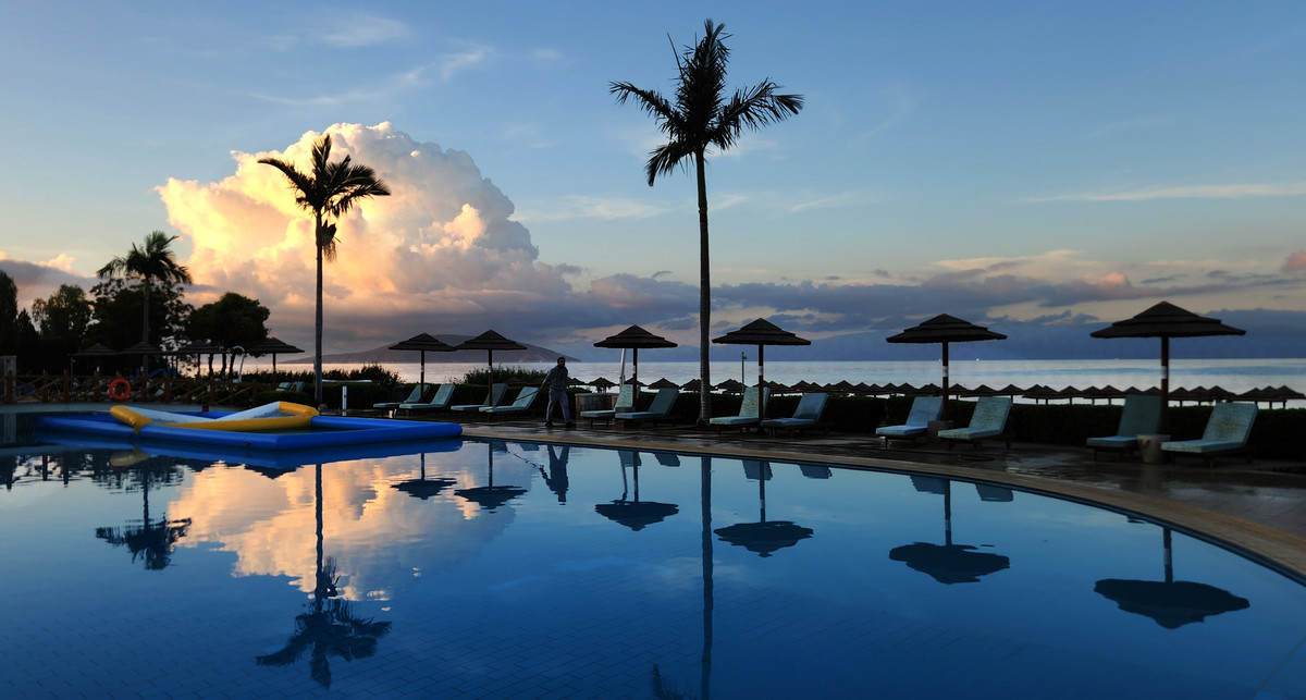 Sunrise at a seaside pool