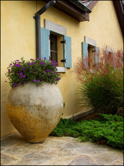 Stone vase and a house