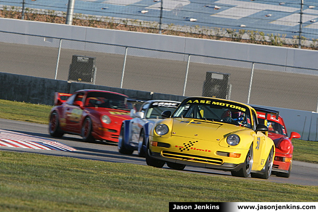 Group of 4 cars entering Turns 8 and 9