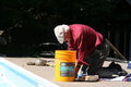 Man closing pool