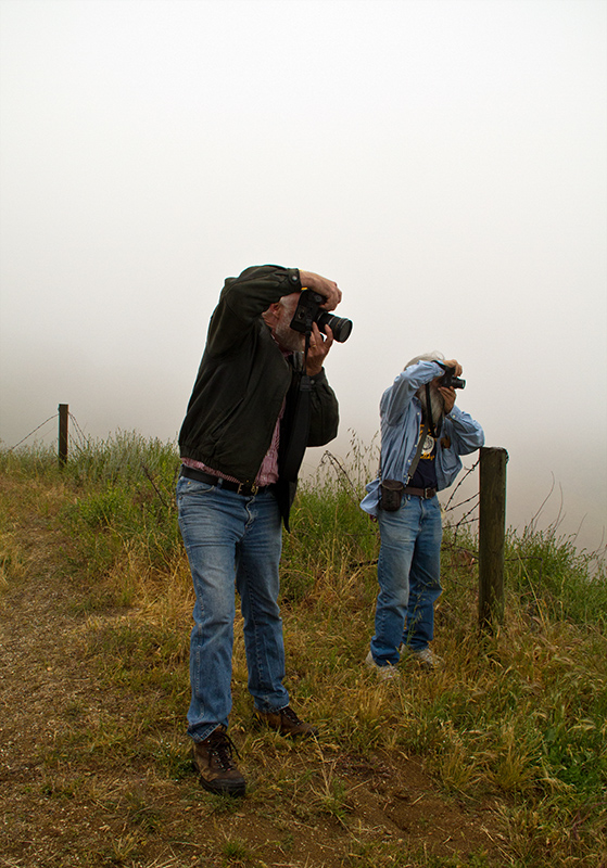 Brennan and Paul shooting as the fog clears below us 