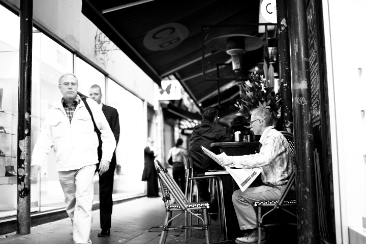 man reading paper small.JPG
