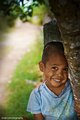 The kid under the tree