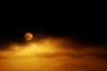 sun behind clouds