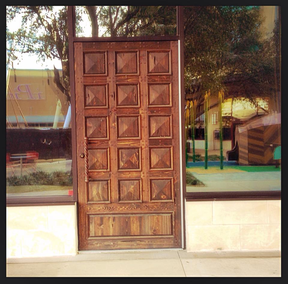 A door surrounded with windows