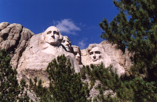 Mount Rushmore framed by trees