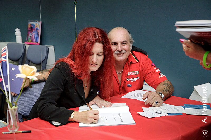 Signing the book