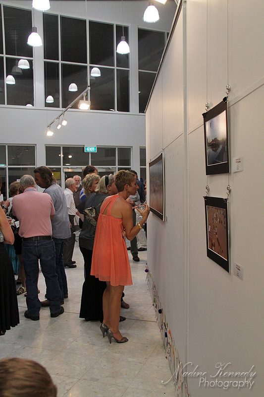 People inspecting images