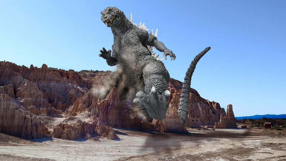 godzilla-stepping-over-rocks