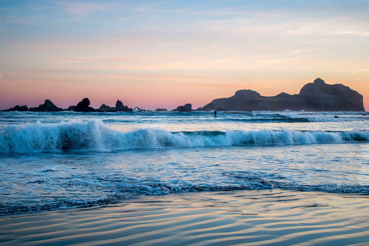 Surfing at sunset