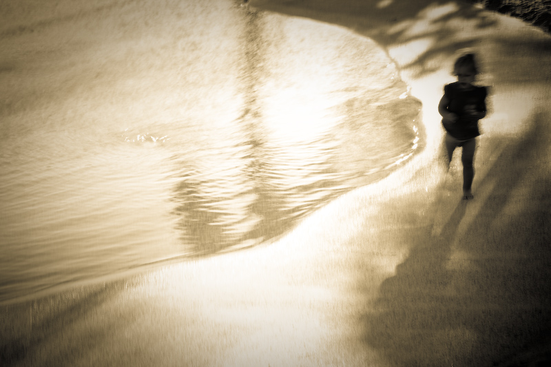 Toddler's stroll along the shore