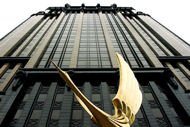 Golden bird and building