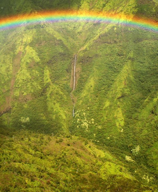 rainbow over waterfall