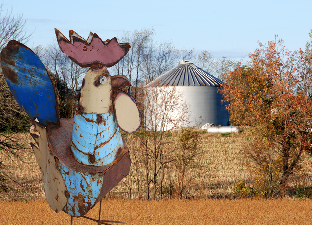 Giant metal chicken looked homeward one last time before setting out on his quest