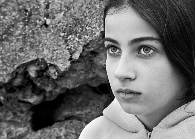 by the weathered wall